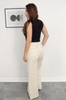 Jean Eva en denim beige, tiro alto, disponible en tallas S a XXL.