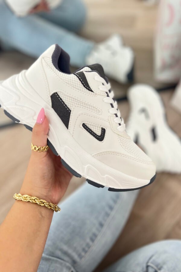 Tenis Alma negros con detalles blancos, cómodos y en tendencia, estilo urbano y moderno.
